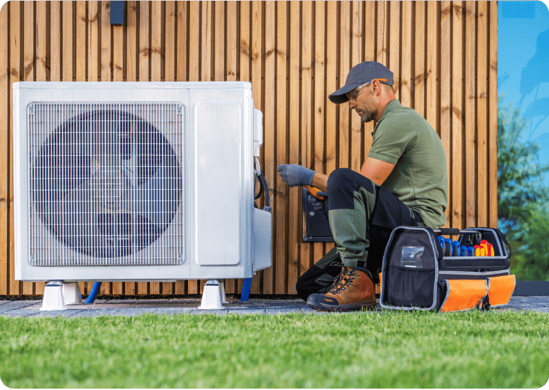 Technician repairing outdoor air conditioning unit.
